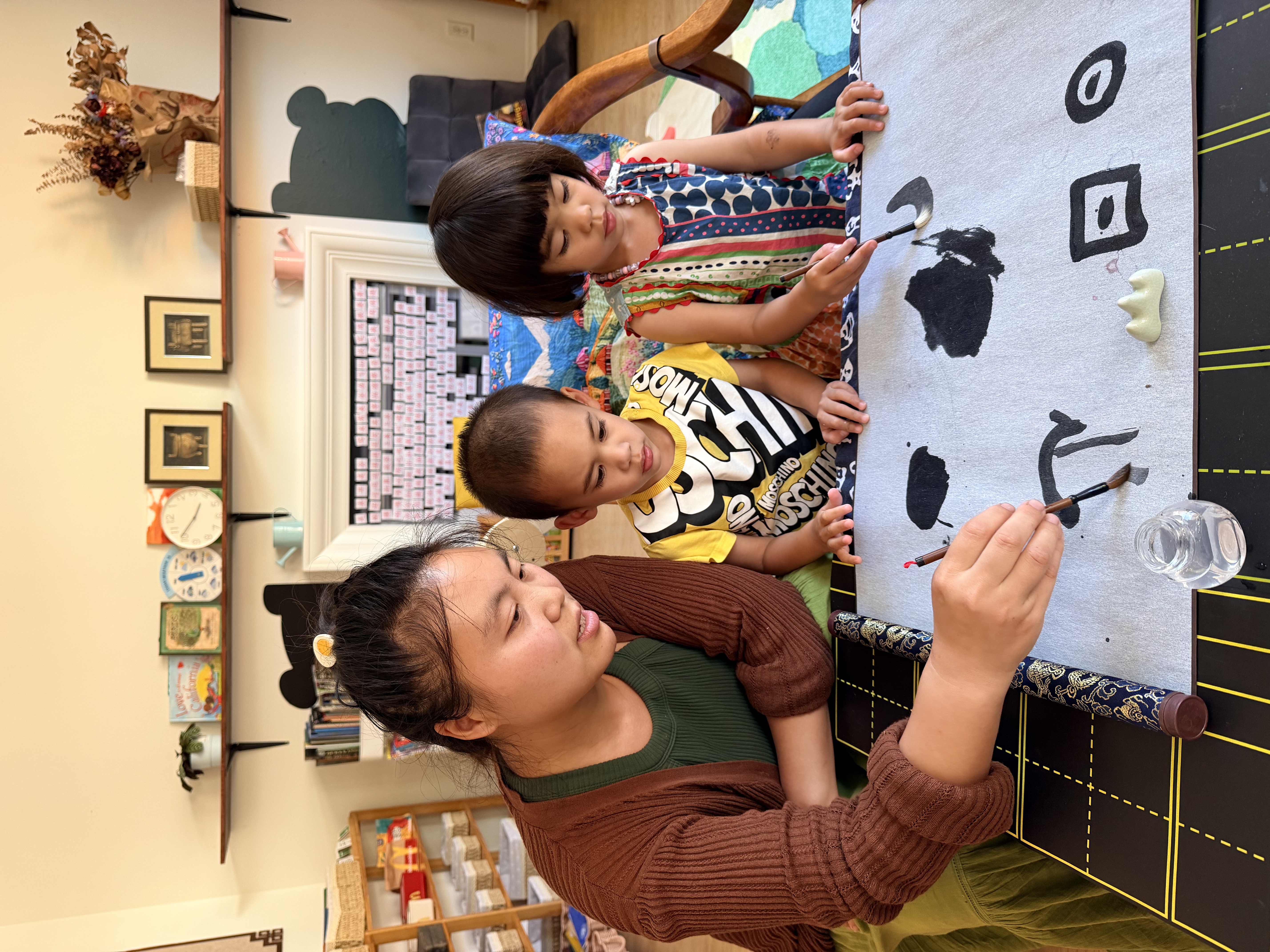 Primary children engaged in creative classroom work