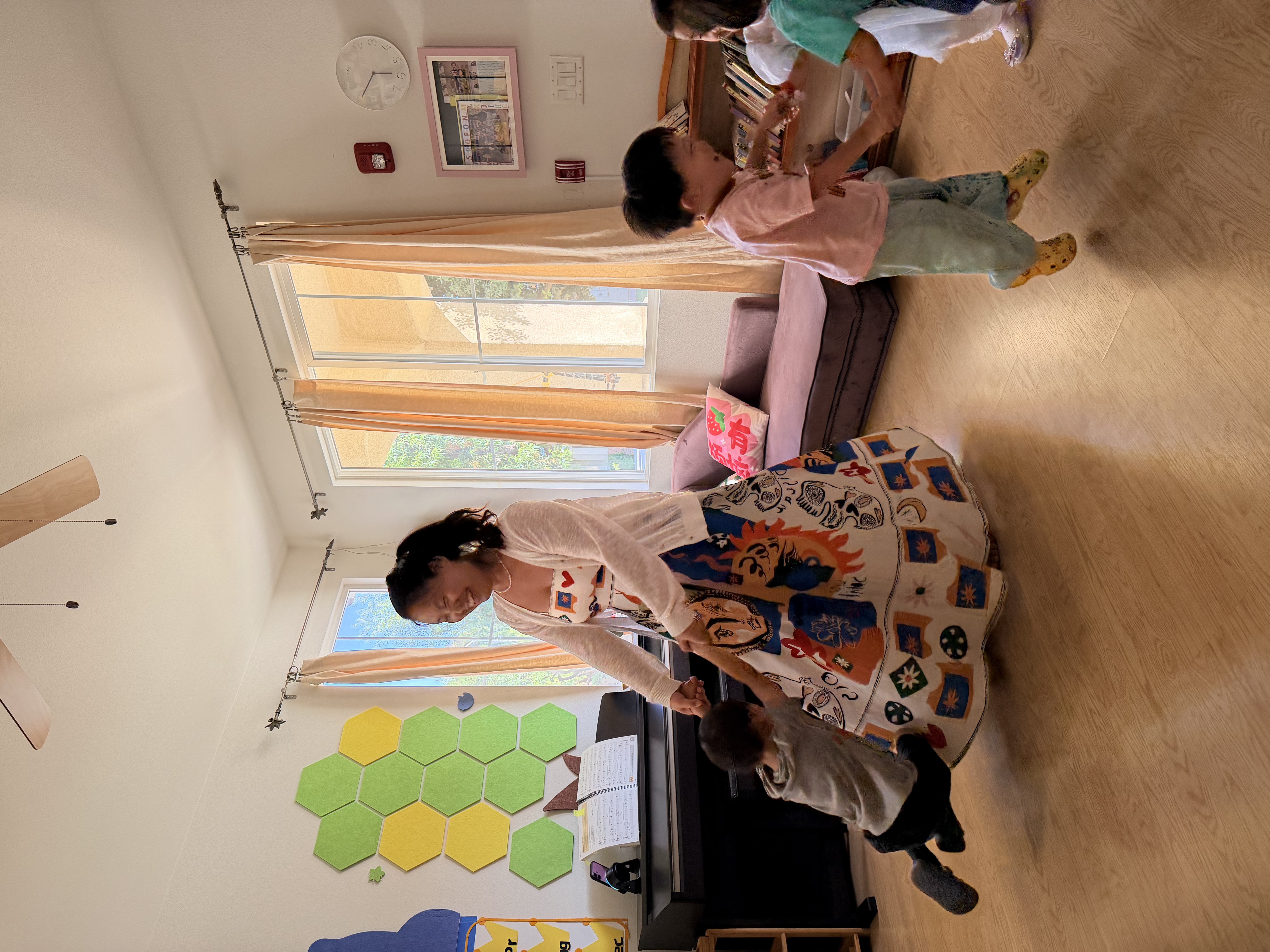 Toddlers exploring prepared Montessori materials
